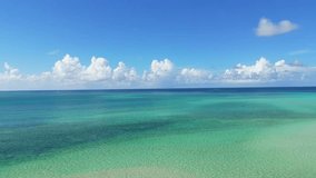 Drone aerial video of the emerald green and cobalt blue sea of ​​Miyakojima in Okinawa, Japan