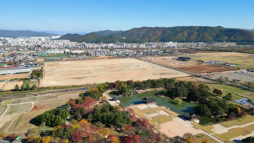 Gyeongju: Aerial view of city in South Korea, Donggung Palace Wolji Pond, trees in autumn colors - landscape panorama of East Asia from above