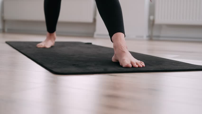 Sporty Woman Doing Stretching Exercise Yoga. Black Sportswear Light Room At home in The morning. Fit Girl Practising Different Asana Poses on the Mat. Concept health and fitness. | Shutterstock HD Video #1100222423