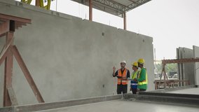Engineers are inspecting work inside a precast concrete factory producing house walls, columns or beams.
 - Powered by Shutterstock - Get 15% off with code: PIKWIZARD15
