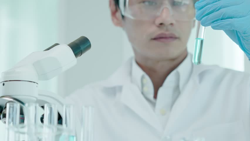 Scientist analyze biochemical samples in advanced scientific laboratory. Medical professional use dropper mix microbiological developmental of viral. Biotechnology research in  science lab. cosmetic | Shutterstock HD Video #1100224289