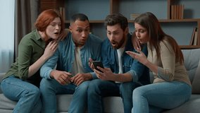 Surprised 30s middle-aged women men consumers read good news on mobile phone cellphone diverse ethnic friends multiracial people using virtual app smartphone indoors win business offer victory fortune - Powered by Shutterstock - Get 15% off with code: PIKWIZARD15
