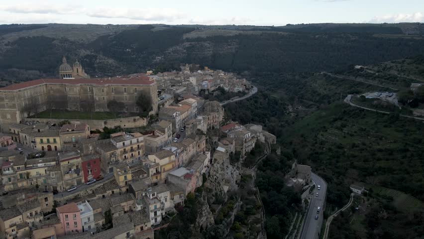 Aerial view of Dottor Solarino Palace and Saint George cathedral in Ragusa Ibla, a medieval town on the hillside at sunset in Sicily, Italy.
