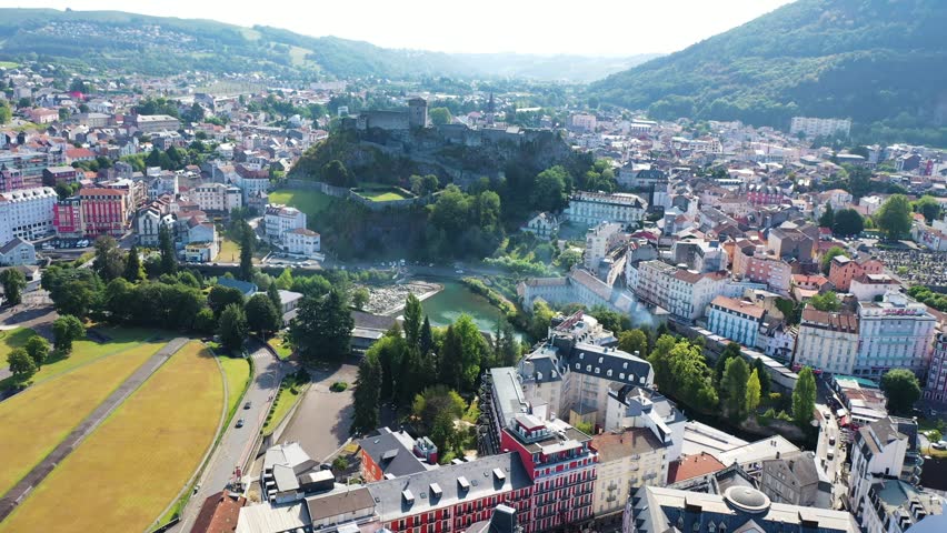 Aerial view of Lourdes downtown in the foothills of the Pyrenees mountains, France.