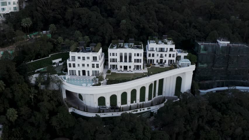 Aerial view of residential buildings on hillside in Hong Kong, China.