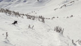 Downihll skier aerial footage, drone, ski mountain, sunny day, winter, ski hill. 4K 24FPS
