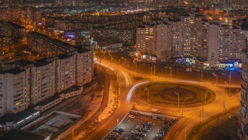 Aerial view time lapse of Kyiv, Kiev dusk skyline. Residential area near the Minska metro station. Obolon. In the foreground we can see a roundabout.