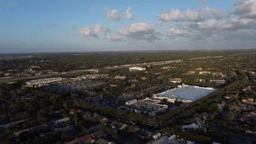 Drone video in motion over a neighborhood in Coral Springs, Florida towards the main highway leading to Miami