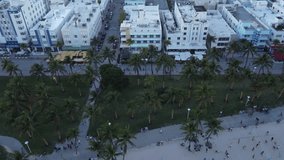 Drone camera motion video revealing the beach and panorama of Miami Beach in Florida at sunset