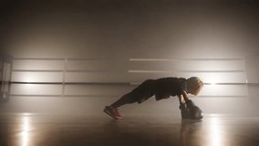 Portrait of caucasian kid preparing for sparring in sport ring. Close-up shot of little boy pushing up in boxing gloves to gain strong body muscles. High quality 4k footage - Powered by Shutterstock - Get 15% off with code: PIKWIZARD15