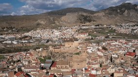 Aerial 4K video from drone to city of Loja and Church of the Incarnation with Moorish Alcazaba and Gorda Peak at Loja ,Granada, Andalusia, Spain, Europe (Series)