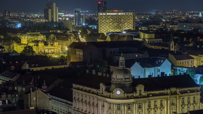 Old town of Zagreb at night timelapse. Zagreb, Croatia. Top panoramic view from Kula Lotrscak tower viewpoint with illuminated buildings