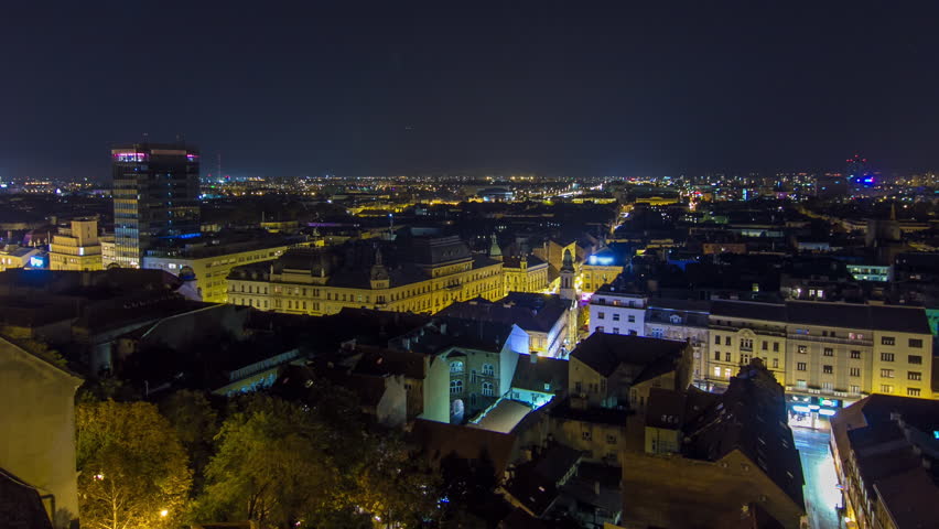 Old town of Zagreb at night timelapse. Zagreb, Croatia. Top panoramic view from Kula Lotrscak tower viewpoint with illuminated square
