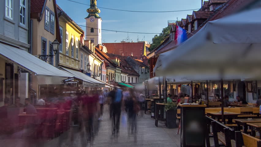 Street ivana racica timelapse hyperlapse in croatian capital zagreb. During sunny day in summer is overcrowded by locals and tourists having lunch in one of many surrounding restaurants. Croatia
