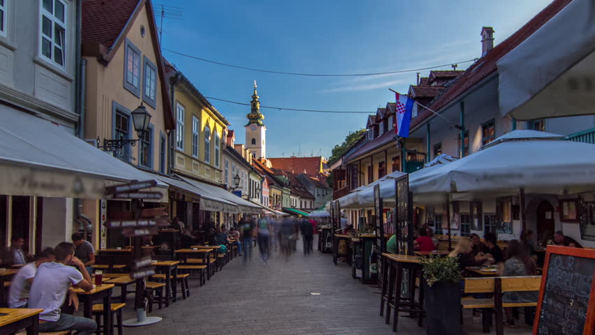 Street ivana racica timelapse hyperlapse in croatian capital zagreb. During sunny day in summer is overcrowded by locals and tourists having lunch in one of many surrounding restaurants. Croatia