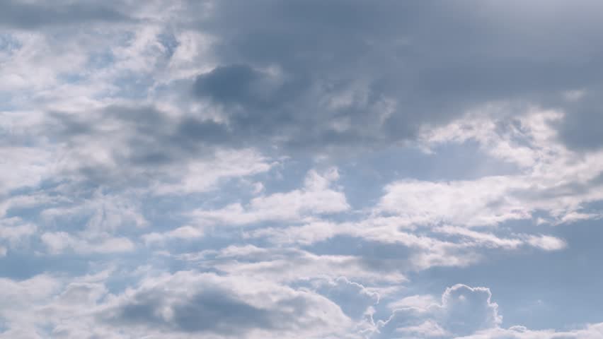 Rolling fast motion formating clouds time lapse, sunny rays shining, blue soft clean sky, good weather. FHD. | Shutterstock HD Video #1100243429