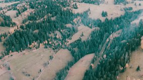 Mountain aerial, epic view. Aerial view of mountain landscape with morning fog, Tatra high mountains in the sunny morning after sunrise. Drone footage of misty forest and magical alpine scenery