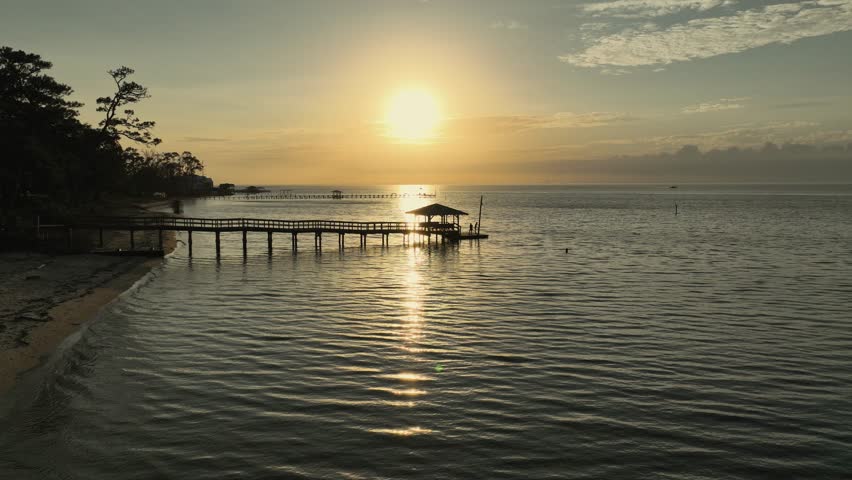 Sunset over Mobile Bay near the American Legion dock in Alabama