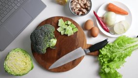 Fresh green broccoli on a wooden cutting board. Macro photo green fresh vegetable broccoli. Green Vegetables for diet and healthy eating. Organic food preparation. Natural kitchen