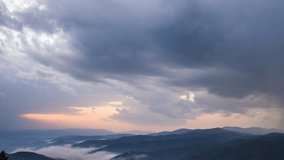 Overcast clouds covered the sky over the Rhodope Mountains with spruce forests and meadows