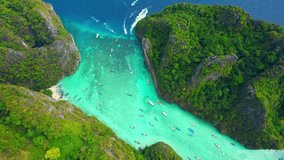 Drone flying over the clear blue waters and limestone hills in tropical sea. The World's Most Beautiful Tropical Sea journeys Destinations. Krabi, Thailand. Summer background video. Nature concept
