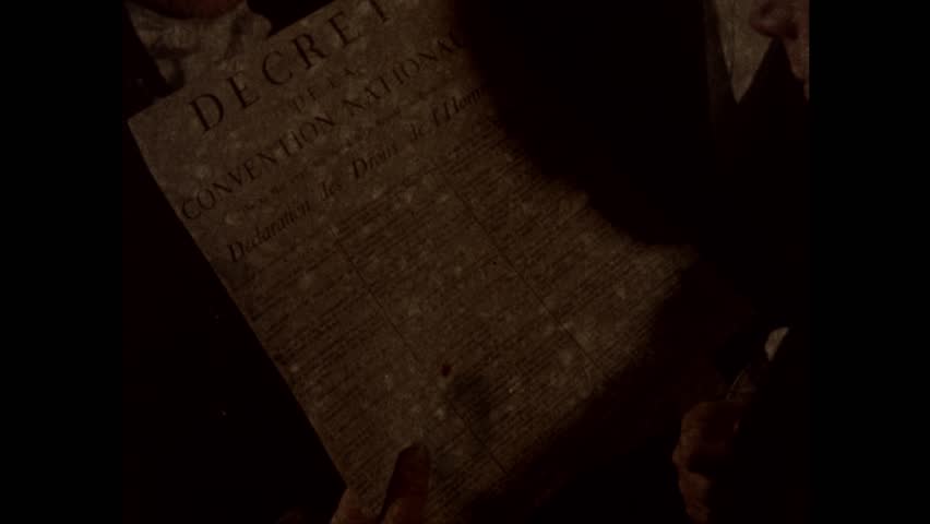 1790s: Hand points to printed document.