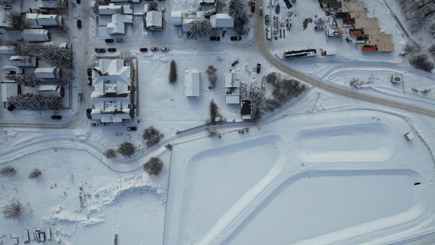 Aerial view of Whitefish, Montana on a cloudy winter day with the Rockies in the background