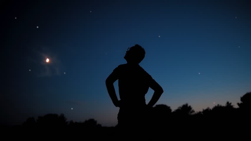 Silhouette of a man with Moon and Milky Way starry skies. Royalty-Free Stock Footage #1100274411