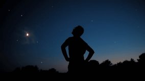 Silhouette of a man with Moon and Milky Way starry skies. - Powered by Shutterstock - Get 15% off with code: PIKWIZARD15