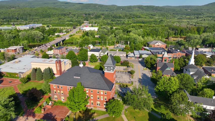 Plymouth town center on Main Street and Plymouth State University aerial view in summer in town of Plymouth, New Hampshire NH, USA. 