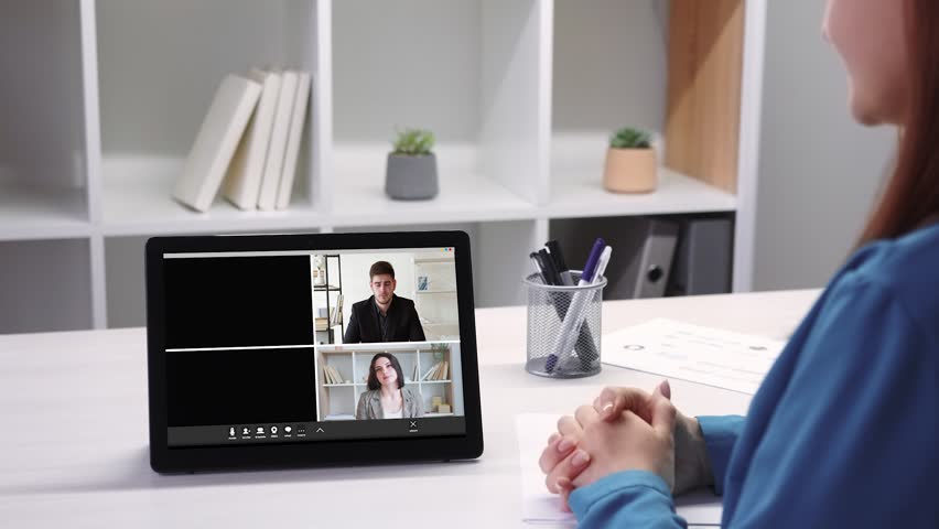 Virtual meeting. Video chat. Online management. Diverse professional business team discussing project on tablet at digital workplace. | Shutterstock HD Video #1100277405