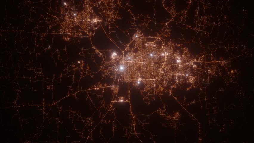 Montgomery (Alabama, USA) aerial view at night. Satellite view on modern city with street lights. Camera is flying above the city, moving forward