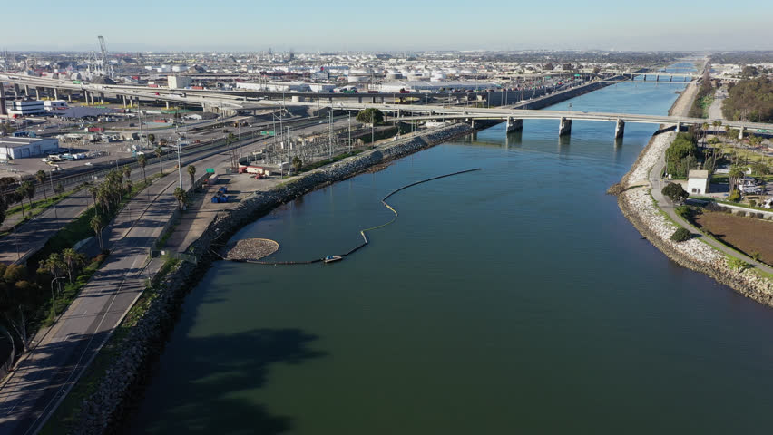 Afternoon aerial view of the mouth of the Los Angeles River as it meets the Pacific Ocean in Long Beach, California, USA.