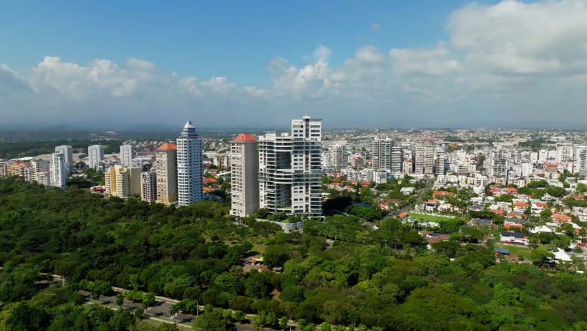 Les Elysees and Les Champs towers buildings skyscrapers with cityscape, Santo Domingo in Dominican Republic. Aerial drone panoramic view