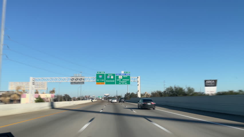 Timelapse driving on Houston Insterstate 69 Freeway during rush hour. Car time-lapse on Texas 59 highway going through multiple ramps and bridges about. Fast forward in time driving on city freeway. Royalty-Free Stock Footage #1100284951