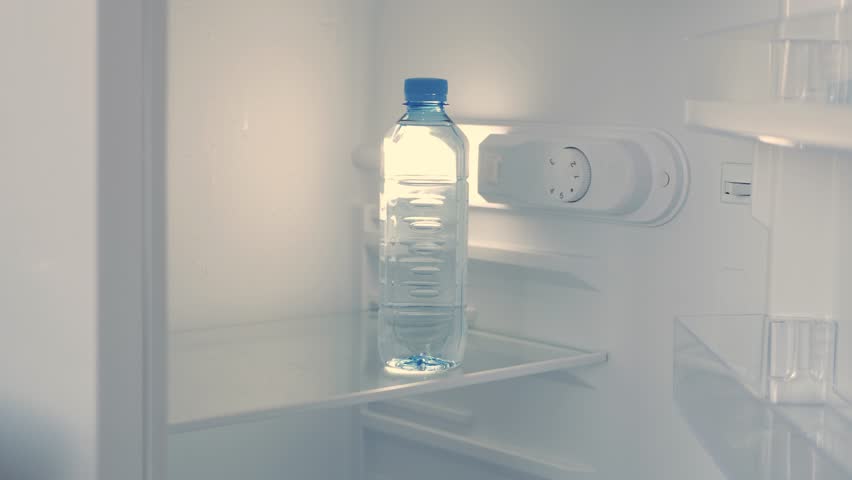 Blurred Shooting with a Man Hand Opening an Empty Fridge Door and Looking Inside for Water and Food. Empty Fridge, Food Crisis Concept. | Shutterstock HD Video #1100291199