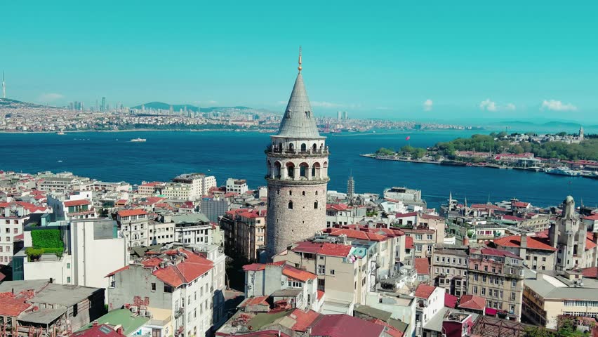 Drone footage of Galata tower in Istanbul in Turkey. Gorgeous historical castle near Bosphorus. Aerial shot of old town. Galata Kulesi Museum, Beyo lu district, quarter. Historical place. Summertime