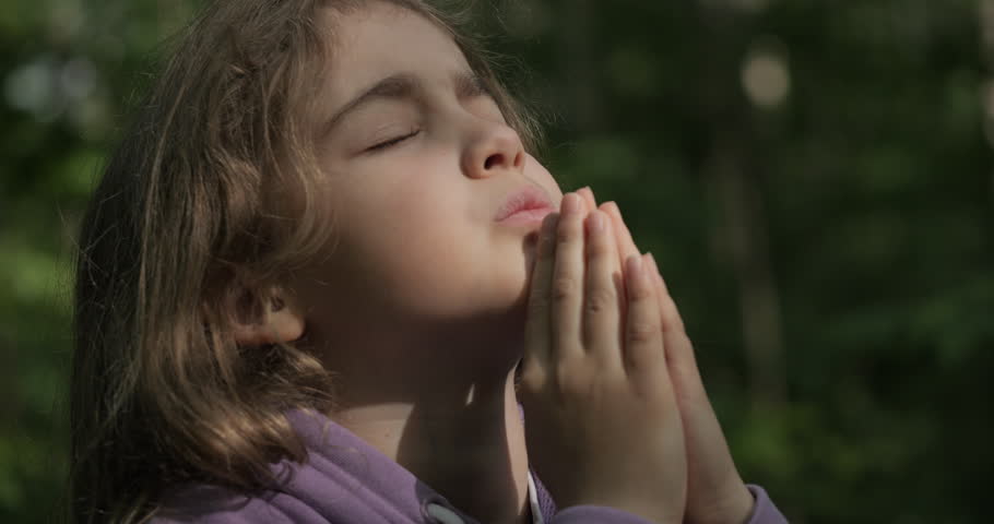Religion. Child Girl Folded Lifestyle Her Hands in Prayer Pray to God on Outdoor. Worried Teenager Girl Looking for Hope and Faith Praying to God. Religious Child With Hope in His Heart Prays to God.