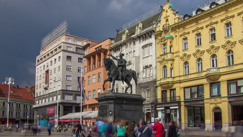 Ban Jelacic monument on central city square (Trg bana Jelacica) timelapse hyperlapse in Zagreb, Croatia. Colorful historic buildings and people walking around Royalty-Free Stock Footage #1100295043