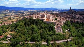 Traditional Italy - scenic medieval town Todi in Umbria with beautiful countryside. Aerial drone video 4k

