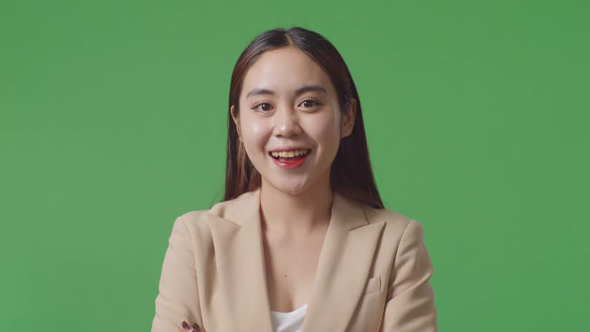 Close Up Of Asian Business Woman Crossed Arms And Warmly Smiling On Green Screen Background In The Studio
 | Shutterstock HD Video #1100304117