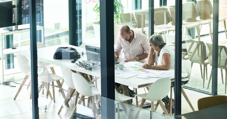 Teamwork, team and accountant working in collaboration and partnership with colleague to calculate financial growth. Overhead, business and people planning a data strategy for a startup in an office | Shutterstock HD Video #1100307025