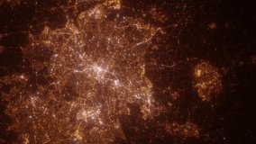 Birmingham (United Kingdom) top view at night. Aerial view on modern city from space. Camera is flying above the city, moving forward. Vertical video. The north is on the left side