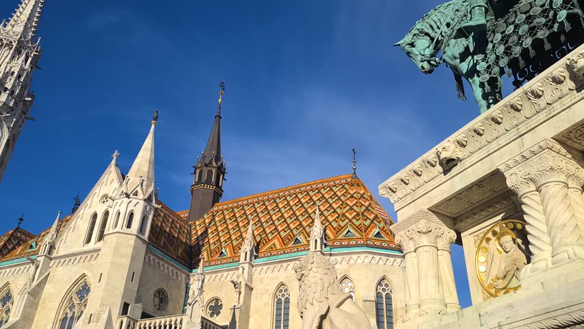 Matthias Church and St. Stephen Statue, Budapest, Hungary. Landmarks on Sunny Morning, Low Angle Panorama