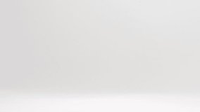 Birthday party celebration rainbow sprinkles raining down and bouncing off white table top in slow motion - Powered by Shutterstock - Get 15% off with code: PIKWIZARD15