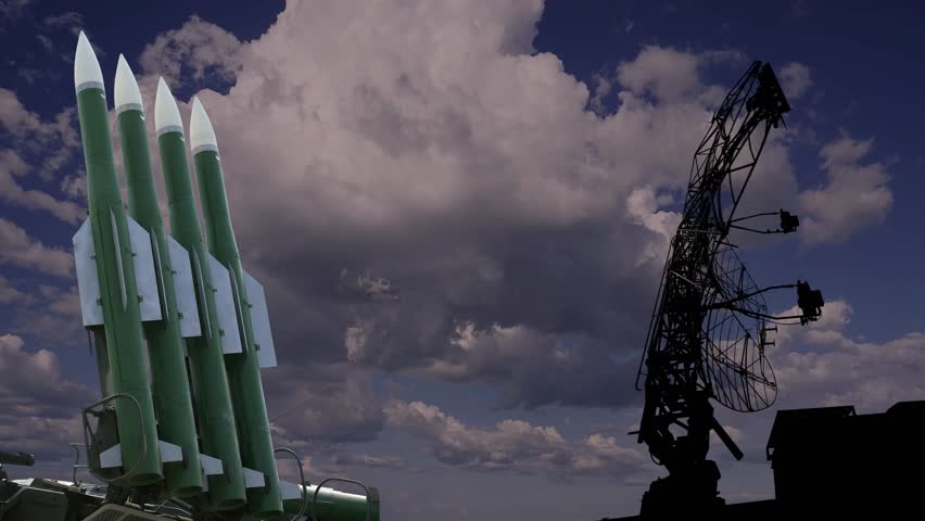 Air defense radars of military mobile anti aircraft systems and Russian anti aircraft missiles on background clouds (time lapse),Russia
