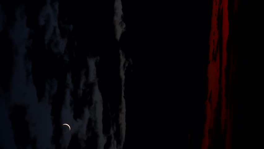 Late dark sunset with crescent moon on the sky,, a Nature Video by Emilio100
