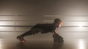 Close-up shot of little boy pushing up in boxing gloves to gain strong body muscles. Active, caucasian kid warming up before intensive sparring. High quality 4k footage - Powered by Shutterstock - Get 15% off with code: PIKWIZARD15