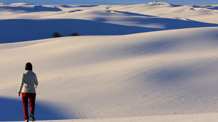 People running in the White Sands National Park at New Mexico, USA