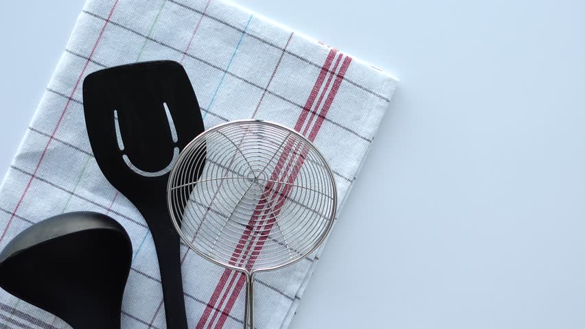 cooking spoon on a table cloth top view 